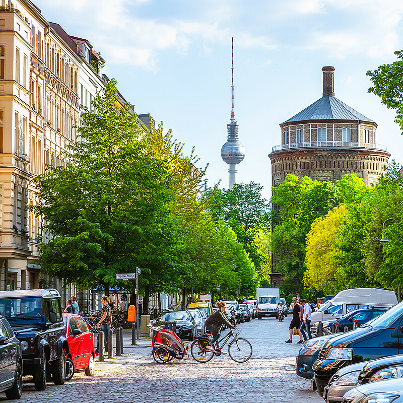 Berlin Prenzlauer Berg with the old historic water tower and the TV tower in the background. The pleasant central district Prenzlauer Berg has many creative businesses.