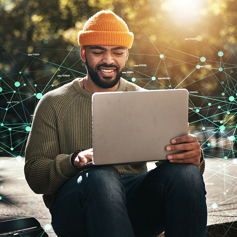 Connected Creativity: Berlin’s contribution to sustainable FinTech solutions Berlin FinTech Professional Develops Sustainable Financial Solutions Outdoors with a Laptop and Connected Graphics